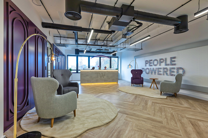 Reception area of Thackray Williams LLP's Bromley office with the People Powered signage on the wall.